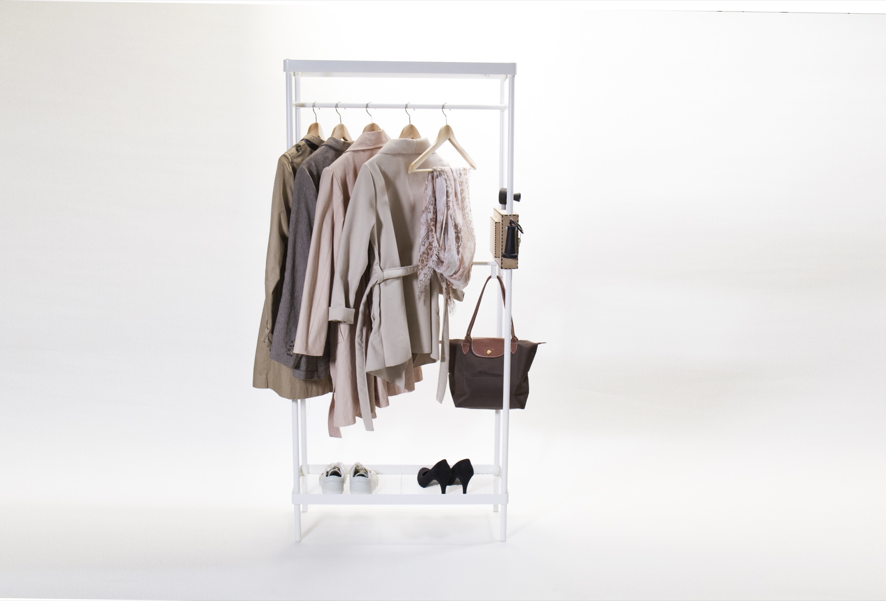 The finished clothes rail with coats, a bag, and shoes, FILO mounted on the side panel
