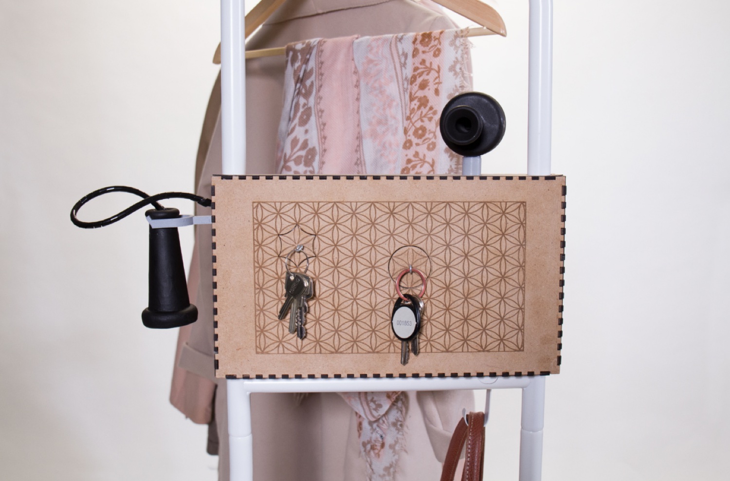 Assembled FILO mounted on the clothes rail with patterned keychains hanging from it